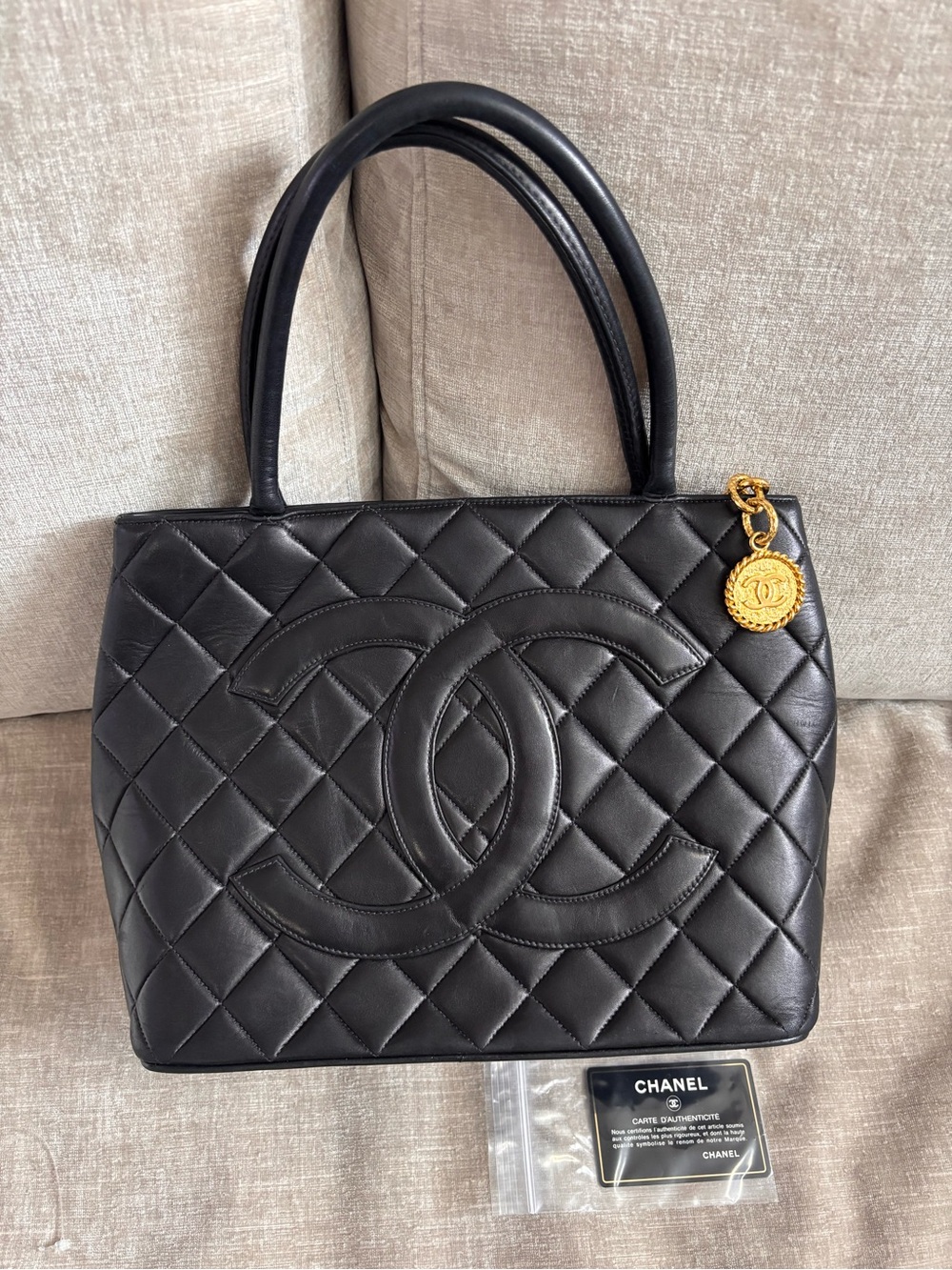 Authentic CHANEL black lambskin leather gold medallion 24k gold tote